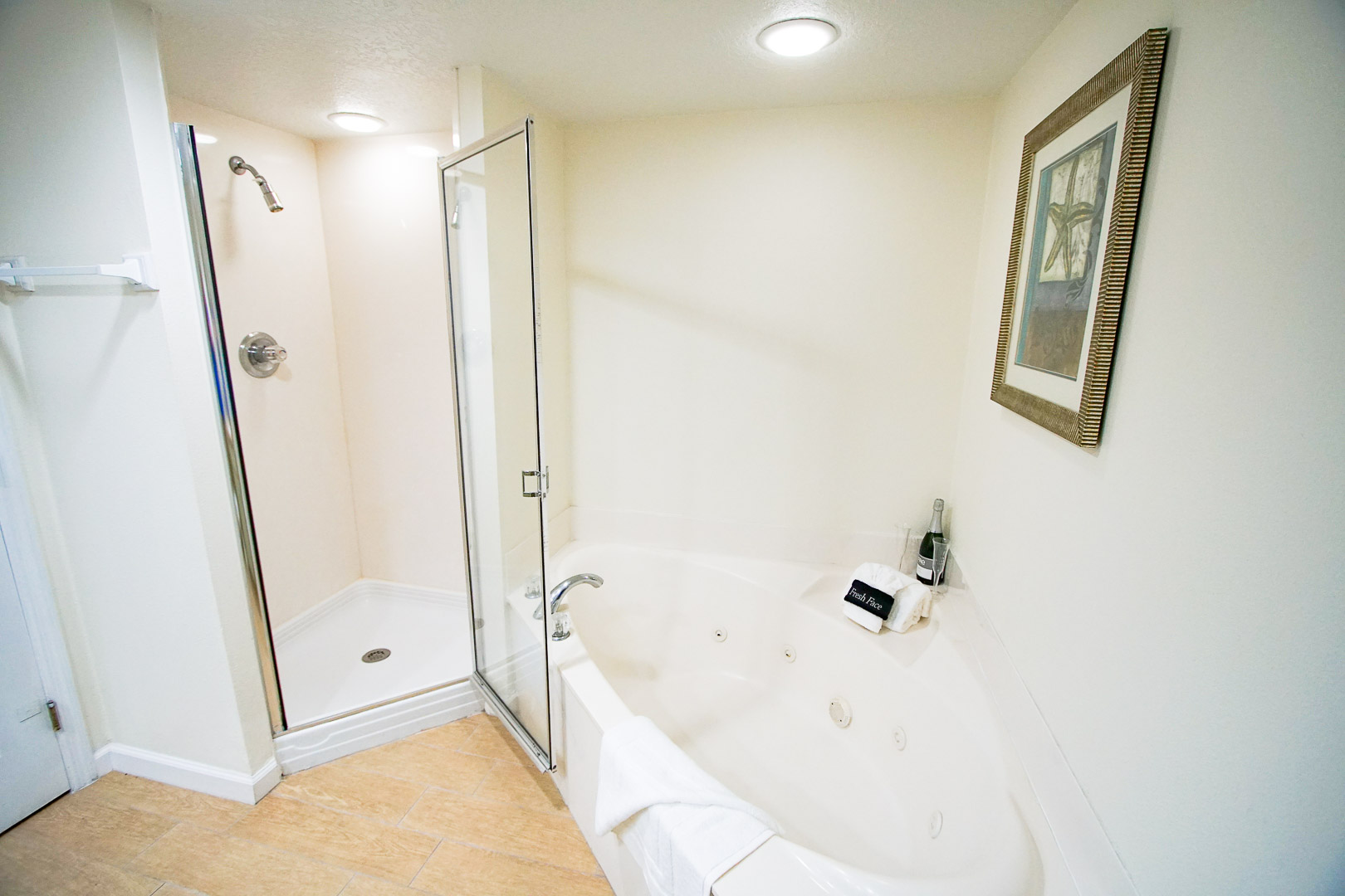 A refreshing bathroom with shower and jacuzzi tub at VRI's The Resort on Cocoa Beach in Florida.